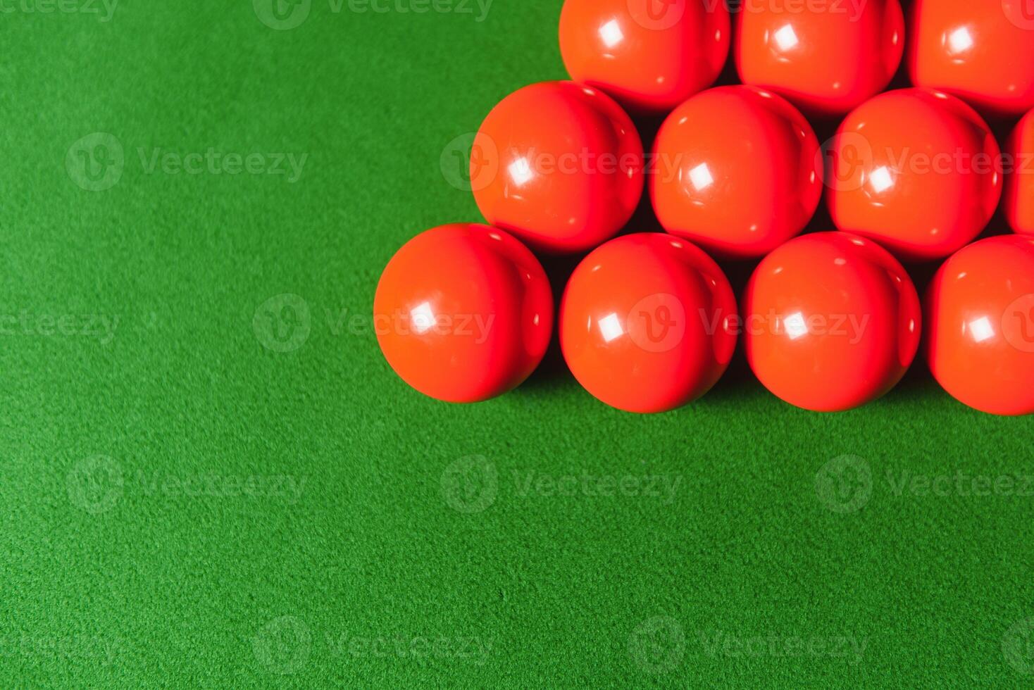 snooker balls set on a green table photo