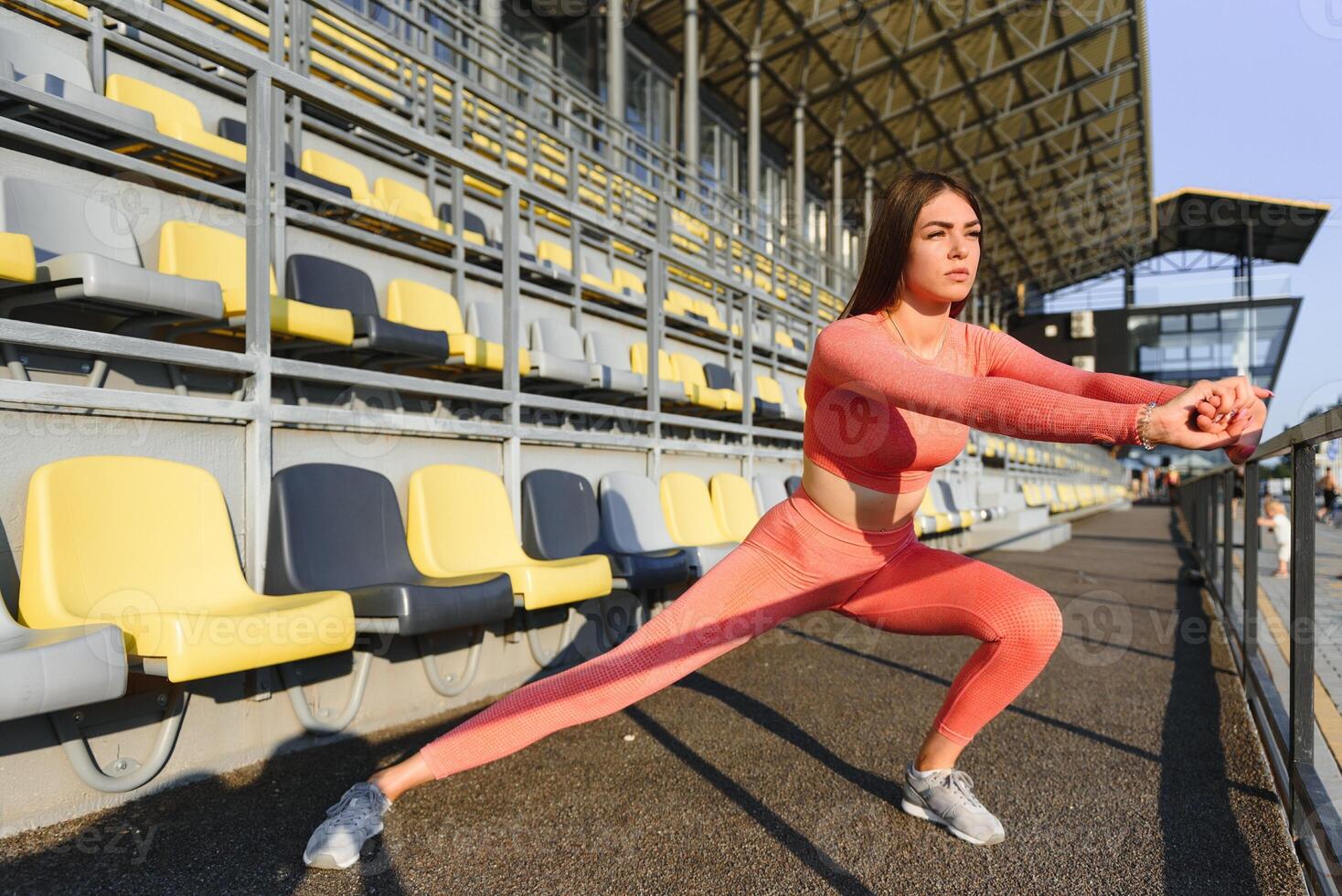 Fitness woman on city stadium photo