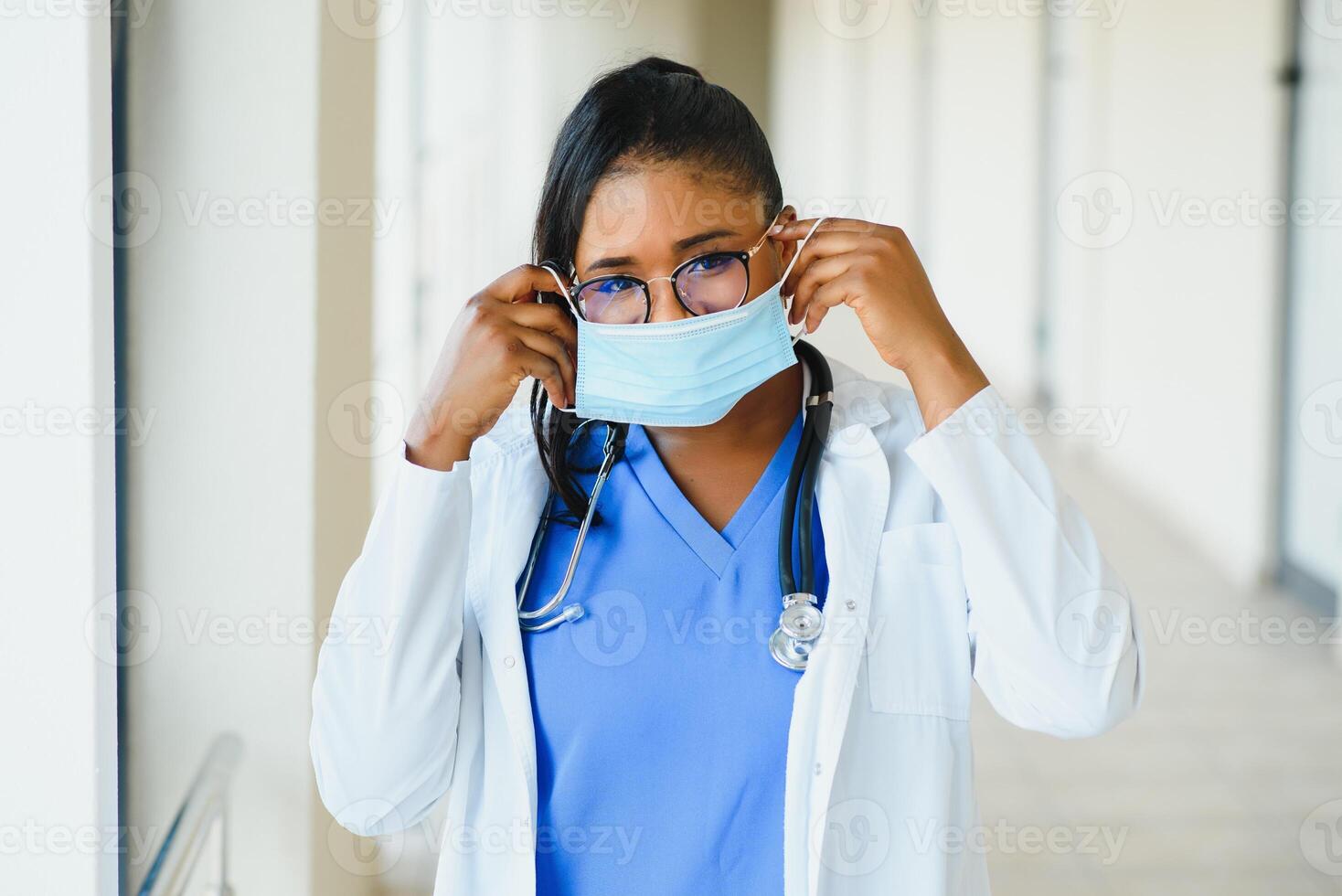portrait of african american female doctor in protective mask at hospital photo