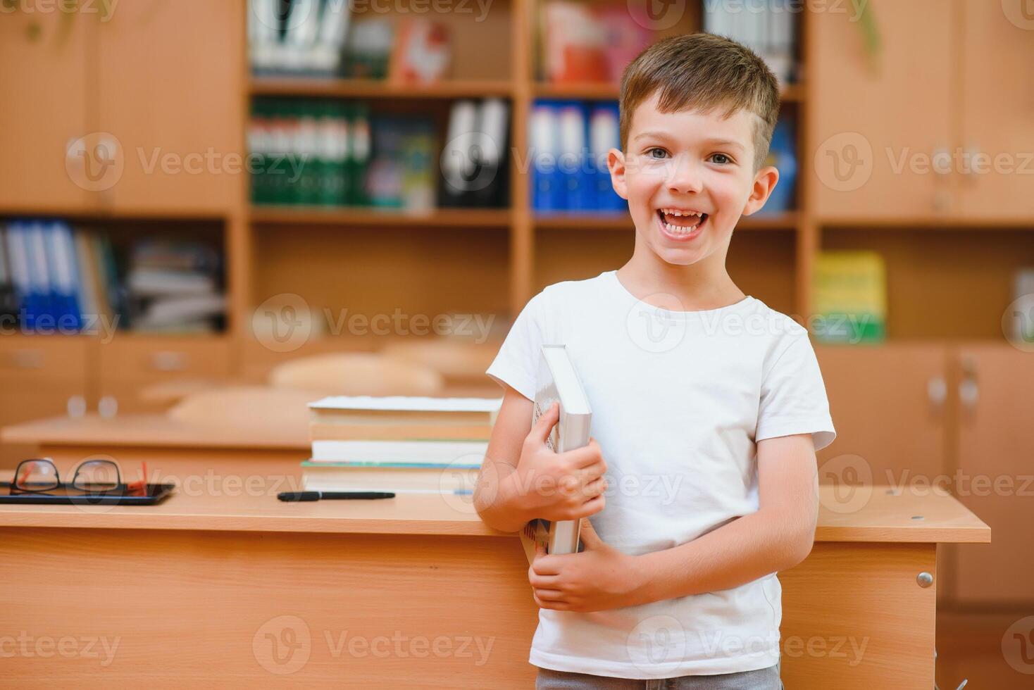 Boy in the school classroom. Back to school. photo