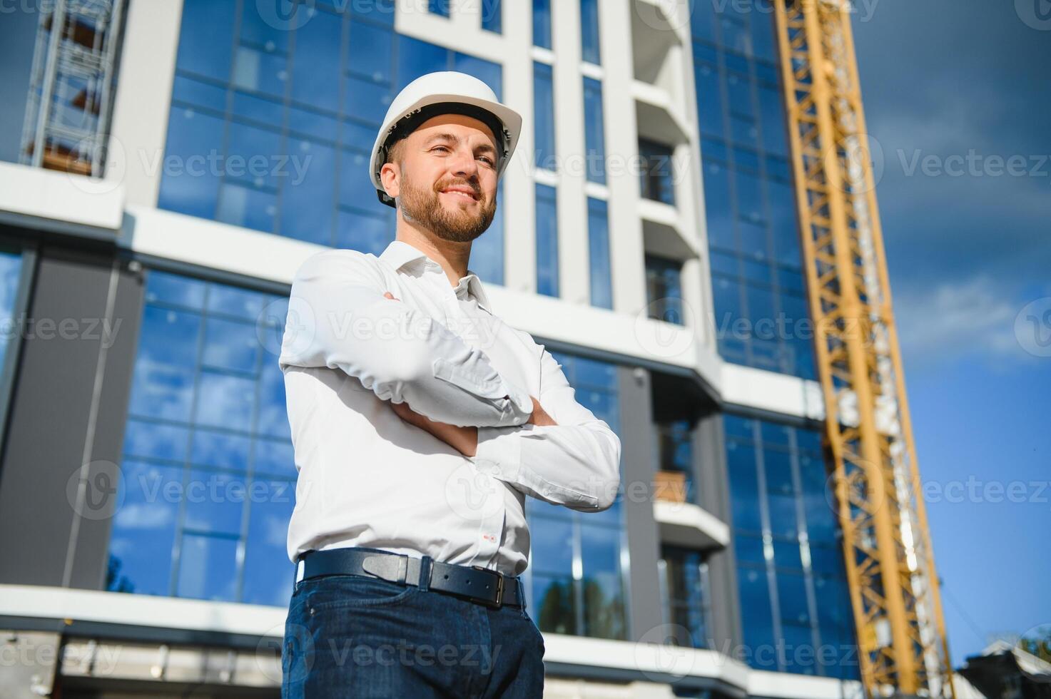 A construction worker control in the construction of roof structures on construction site and sunset background photo