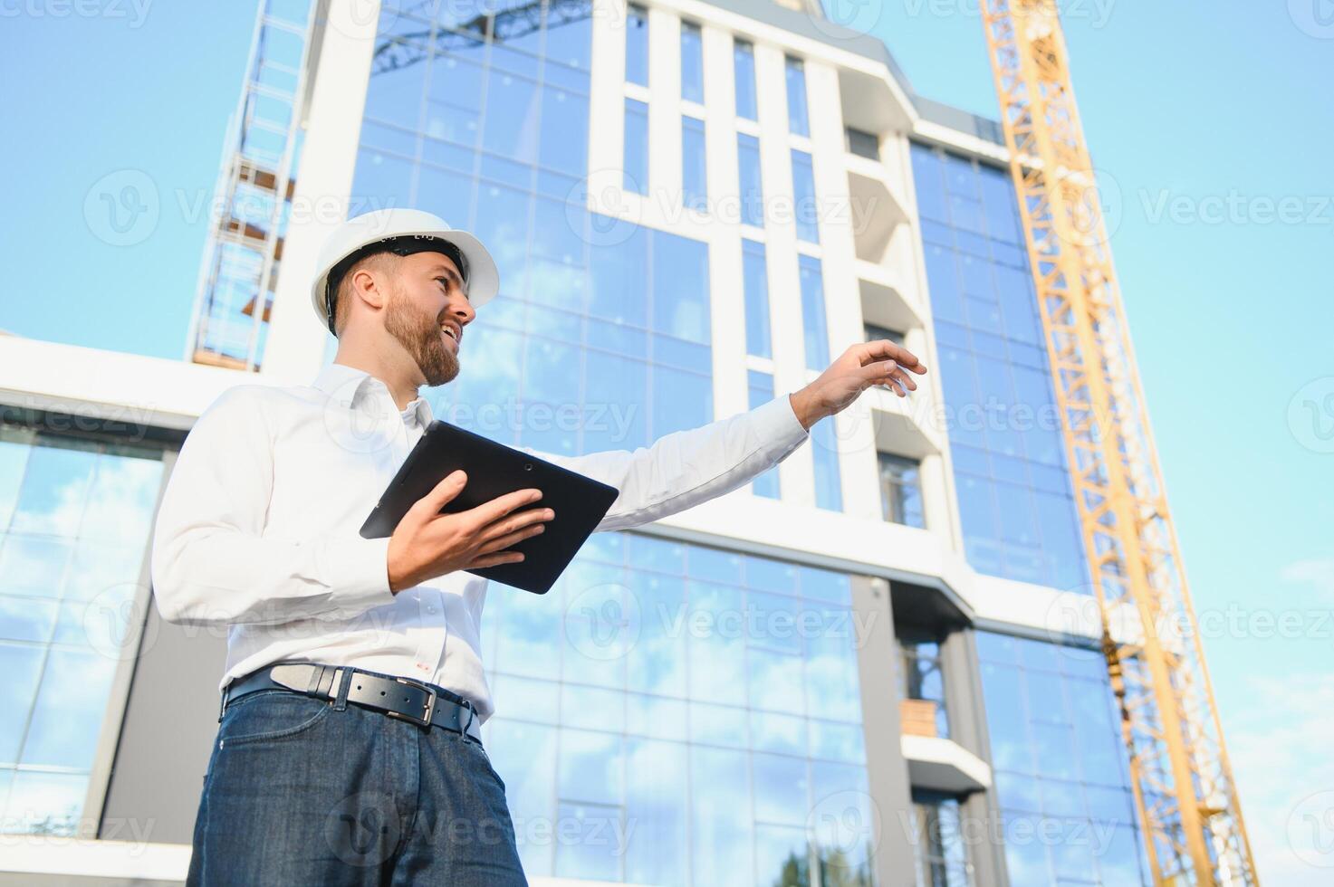 A construction worker control in the construction of roof structures on construction site and sunset background photo