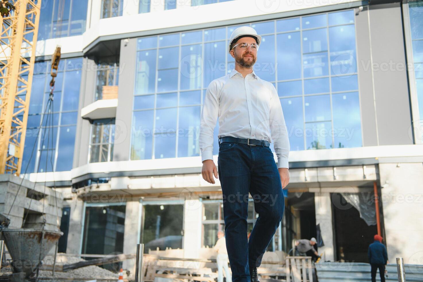 construction worker or architect in construction site outdoors with Hot weather sunny . builder in hard hat inspecting and working in workplace photo
