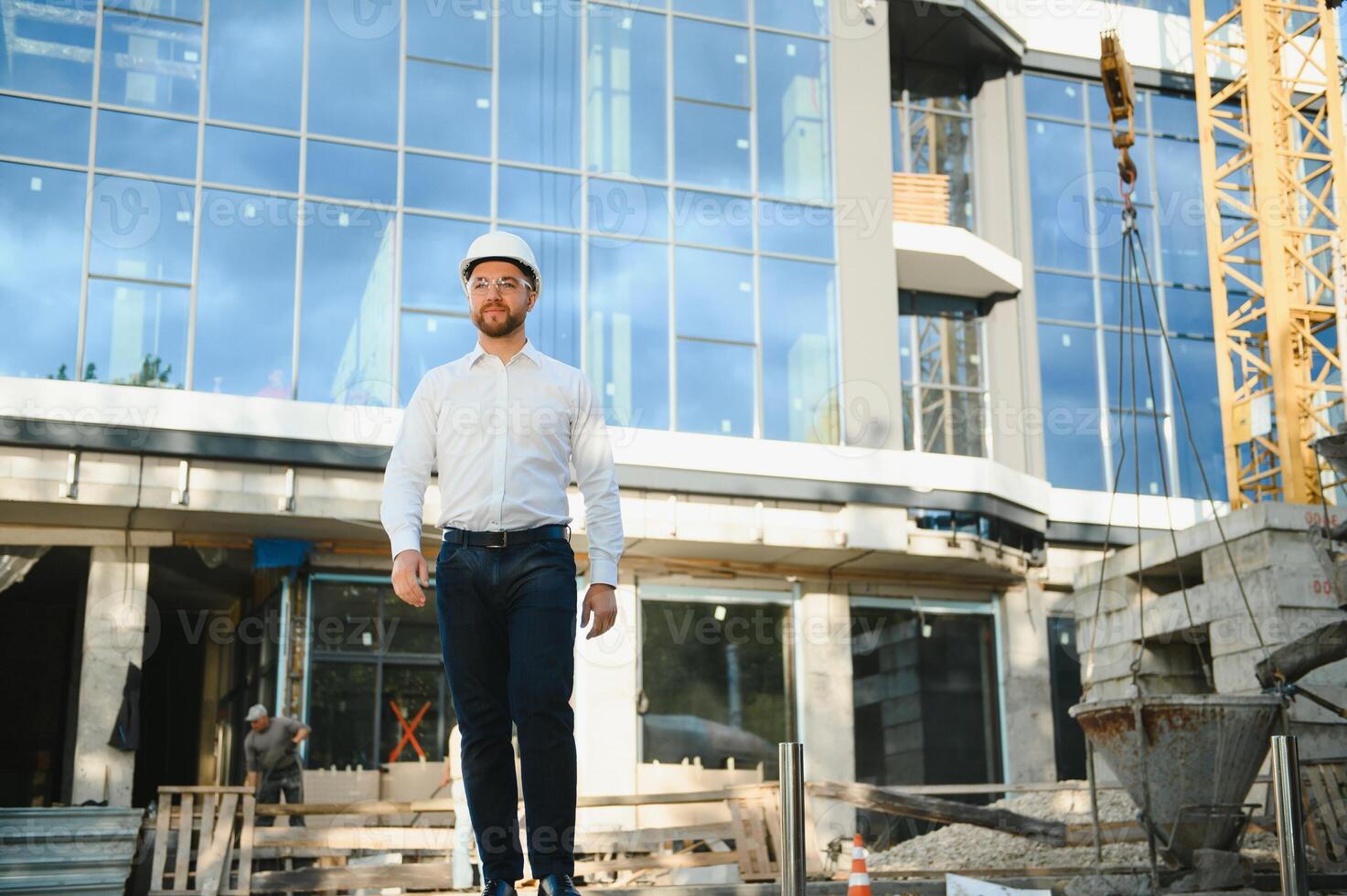A construction worker control in the construction of roof structures on construction site and sunset background photo