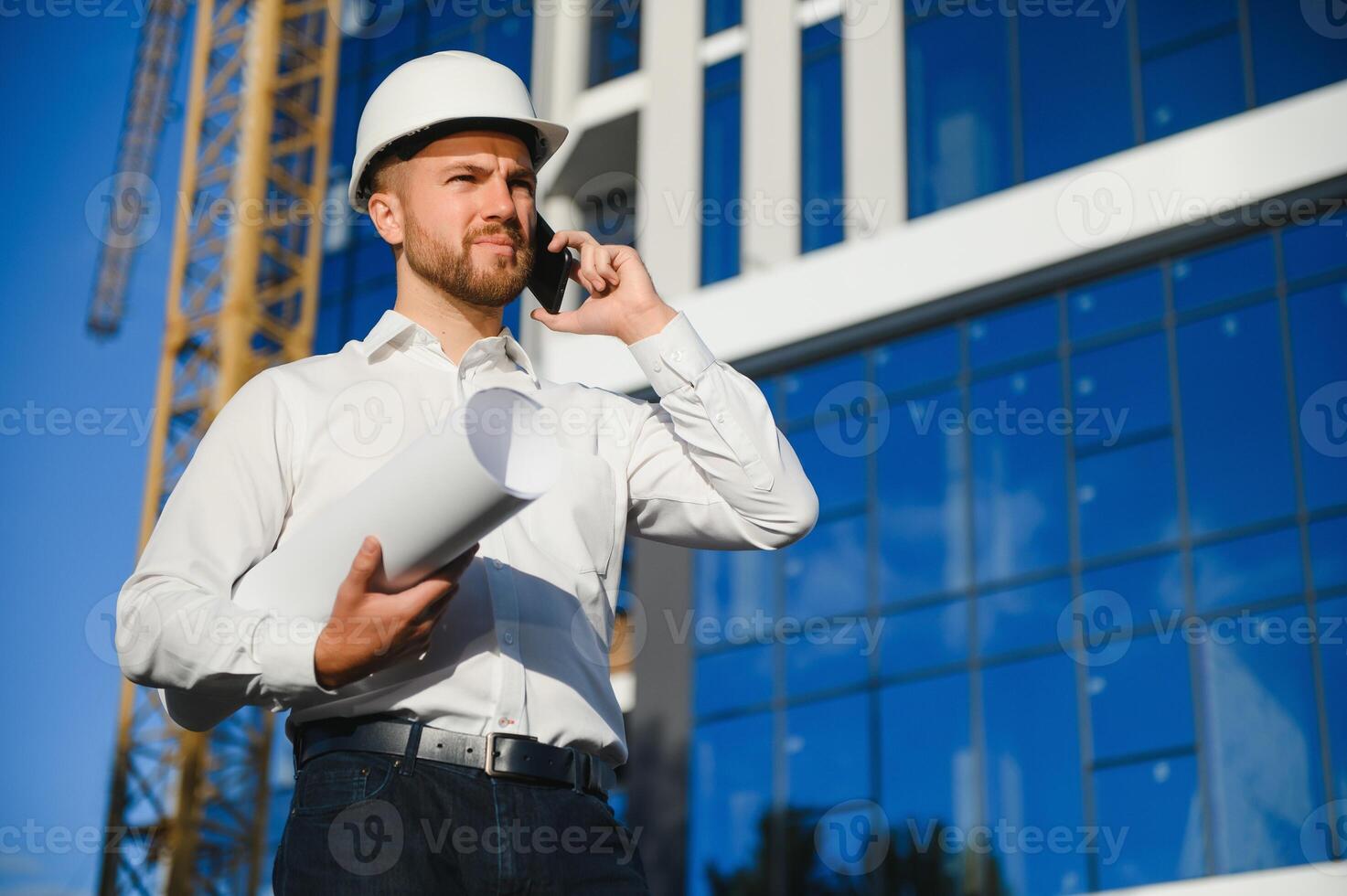 construction worker or architect in construction site outdoors with Hot weather sunny . builder in hard hat inspecting and working in workplace photo