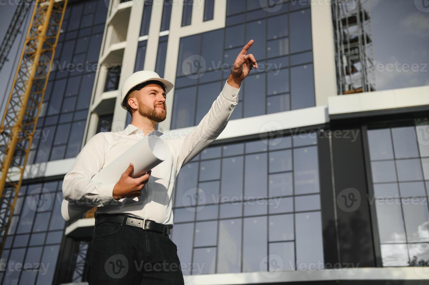 A construction worker control in the construction of roof structures on construction site and sunset background photo