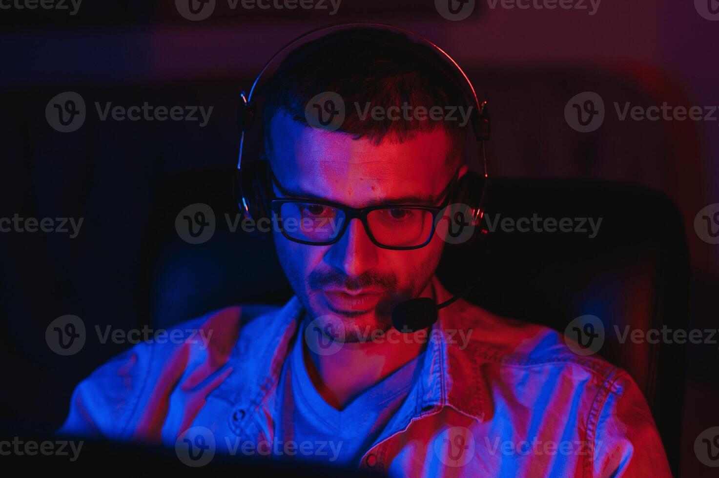Gamer playing a first person shooter on high end pc. photo