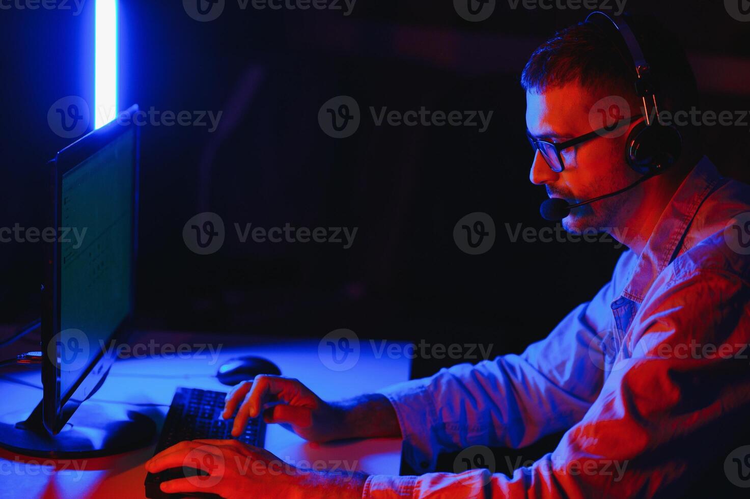 Handsome young male software developer programming codes while working from home photo