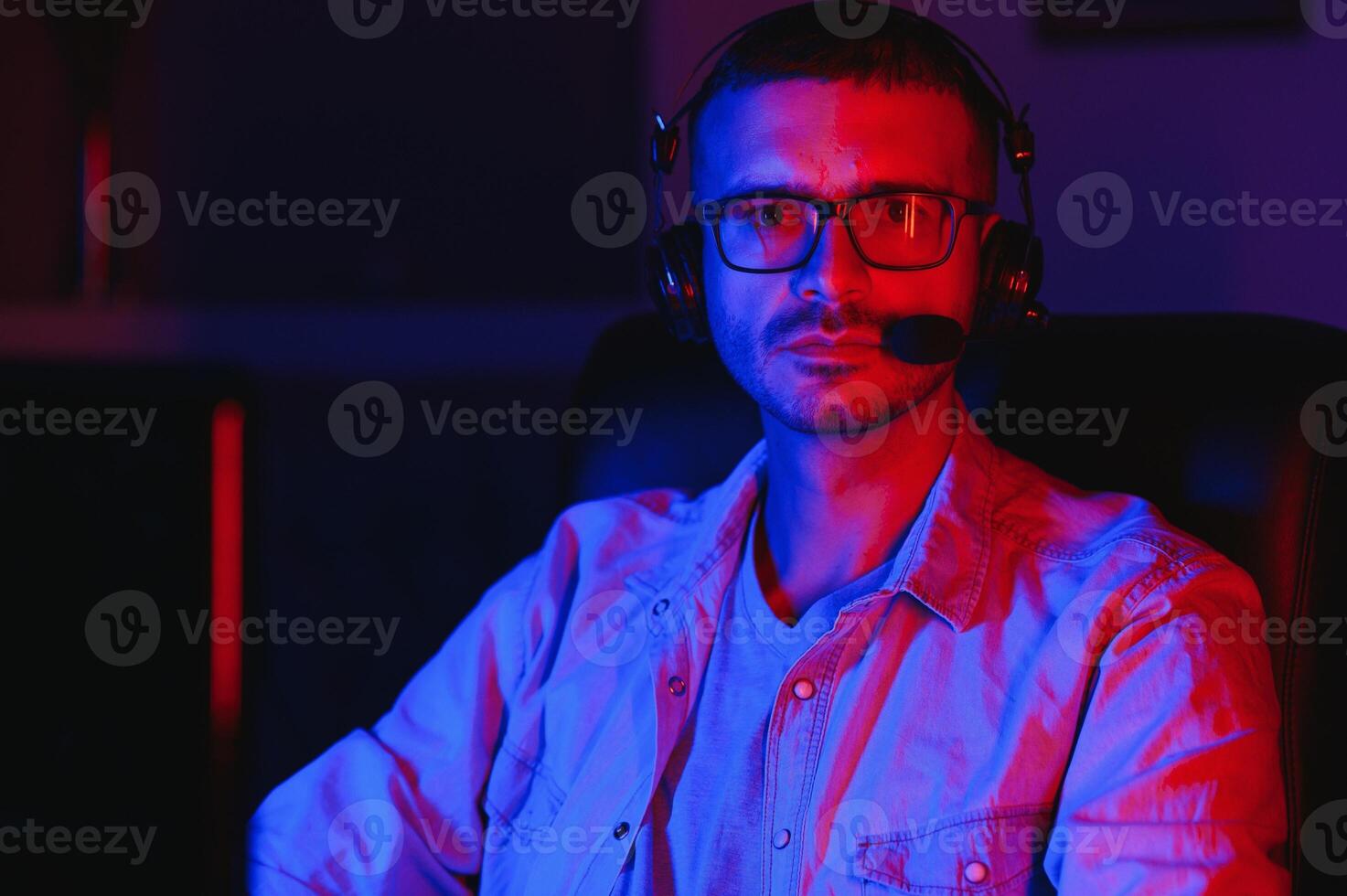 young man playing computer games on line photo