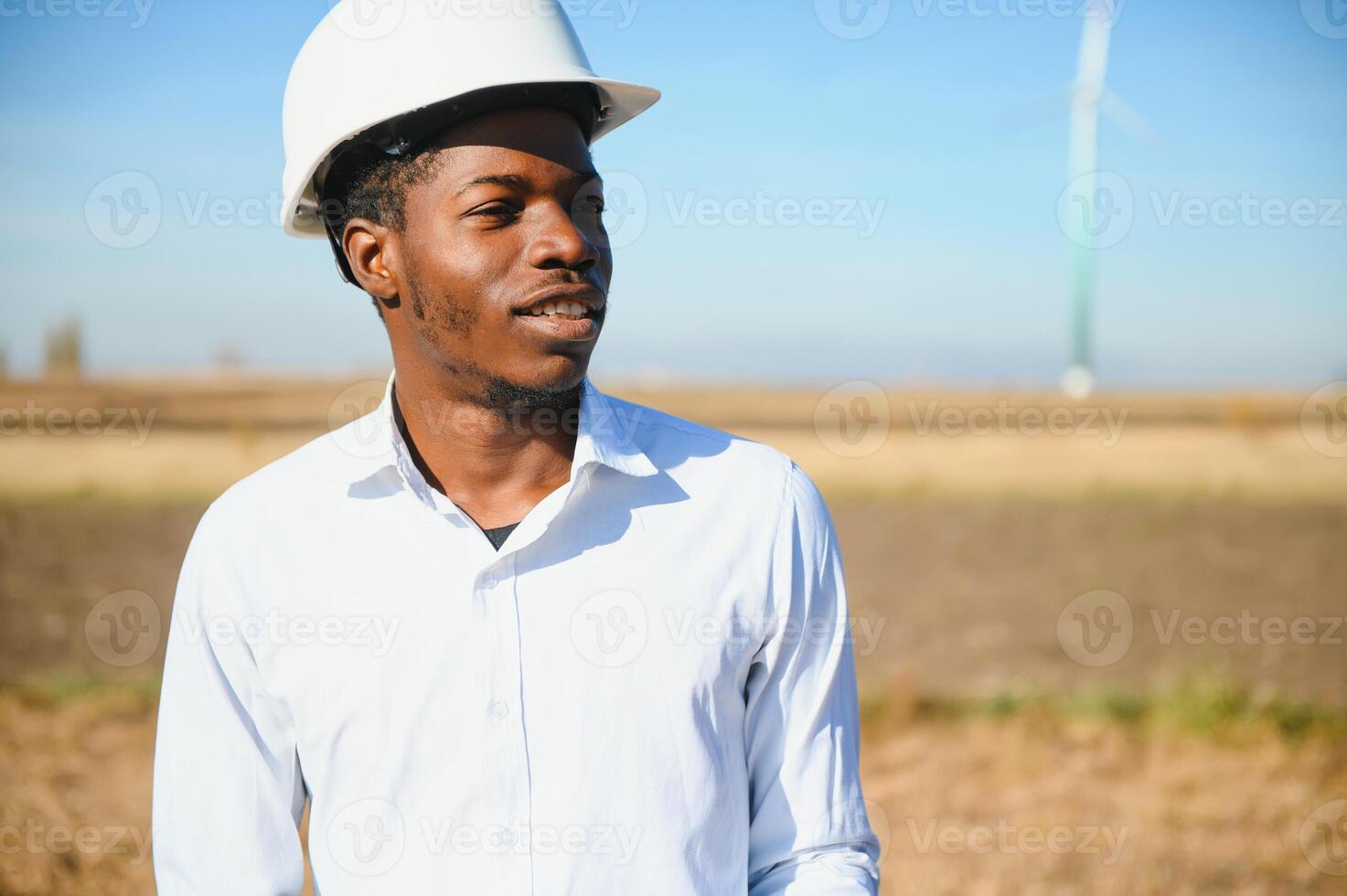 Engineer checks Wind Turbine system with a tablet. Alternative Energy. Wind farm. Clean renewable energy technologies. Wind power plants photo