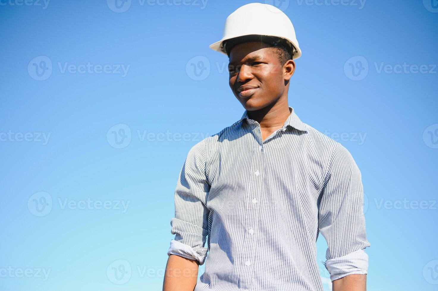 Portrait of happy African construction over with hardhat photo