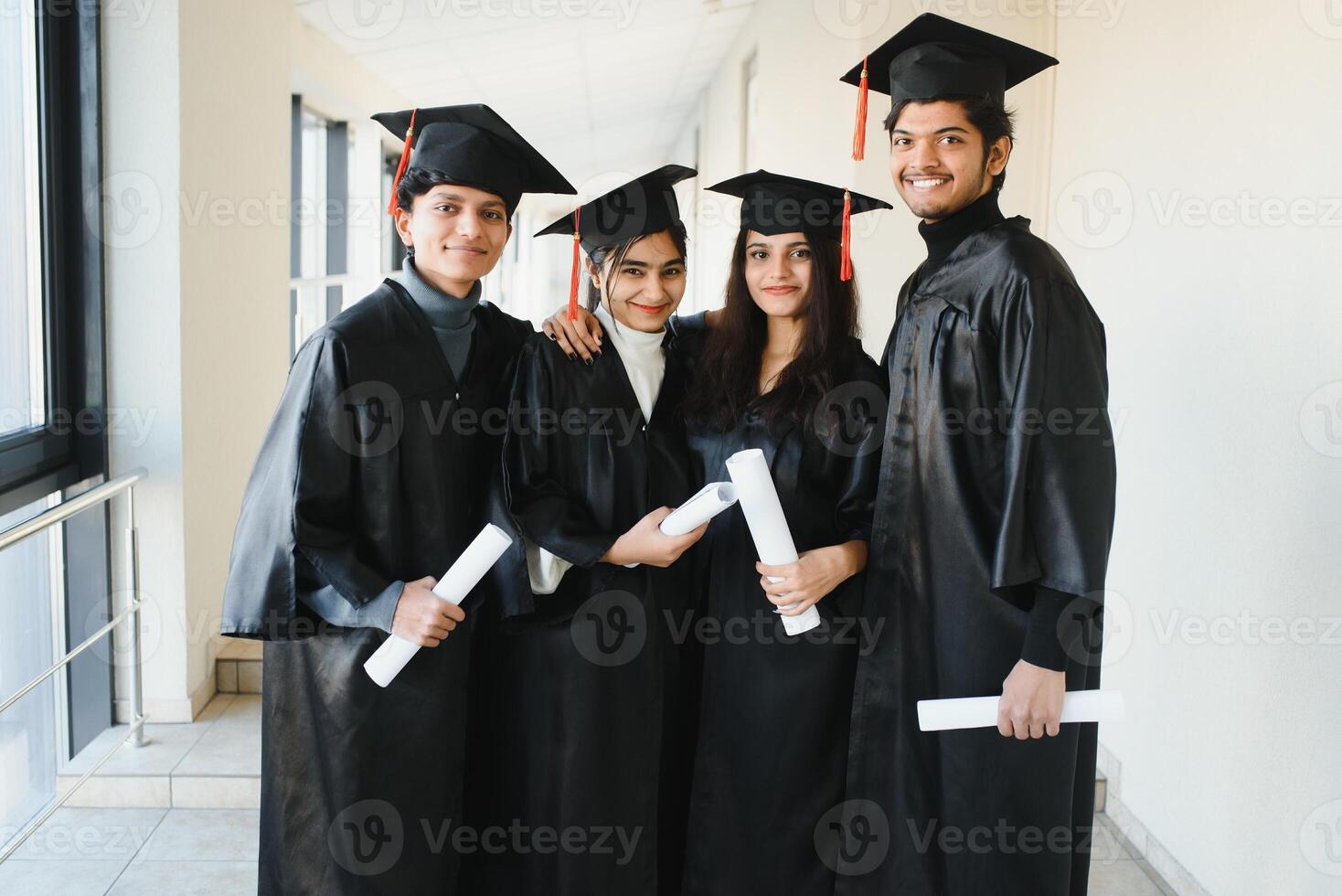 education, graduation and people concept - group of happy international students. photo