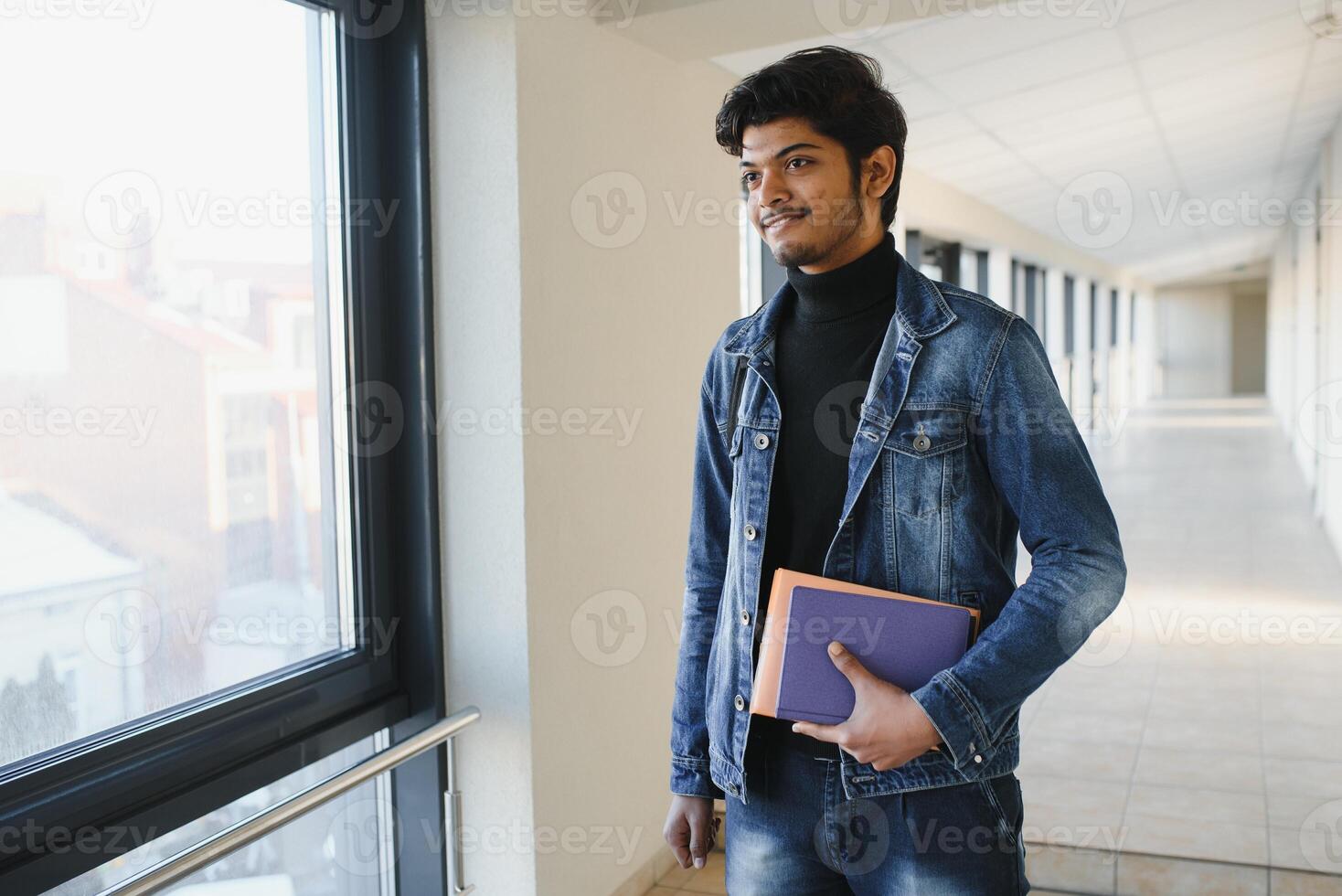 Happy indian male student at the university photo