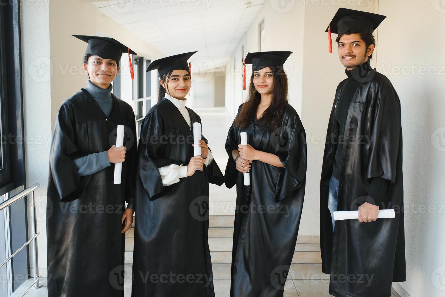 education, graduation and people concept - group of happy international students. group of Indian graduates. photo