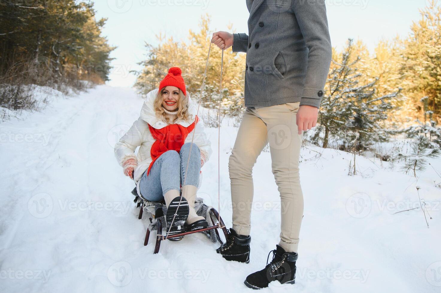 Two young people sliding on a sled photo