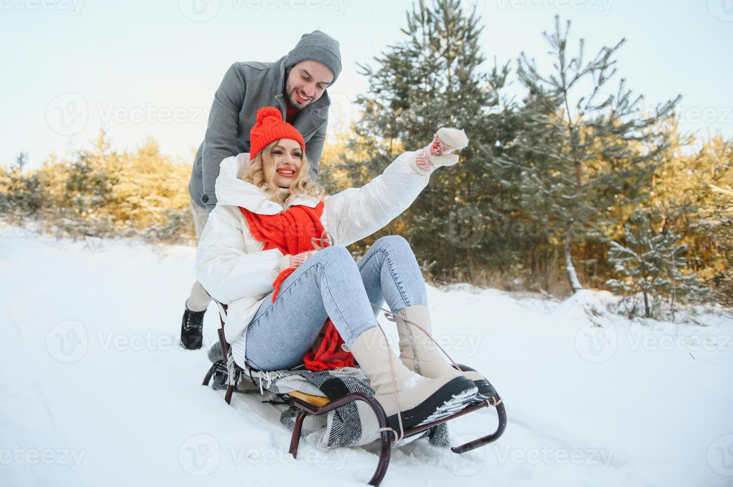 Two young people sliding on a sled photo
