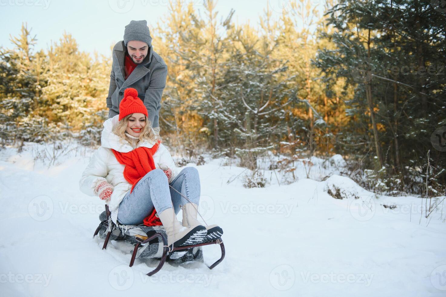 Two young people sliding on a sled photo