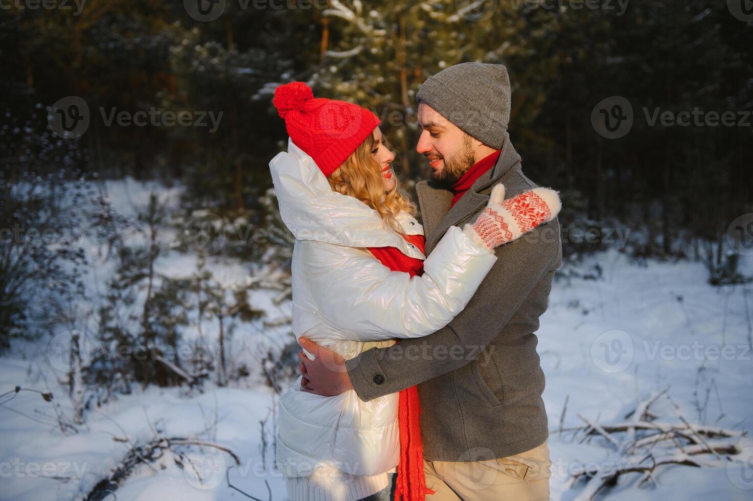 Photo of young attractive couple happy positive smile look each other enjoy time together forest winter love story