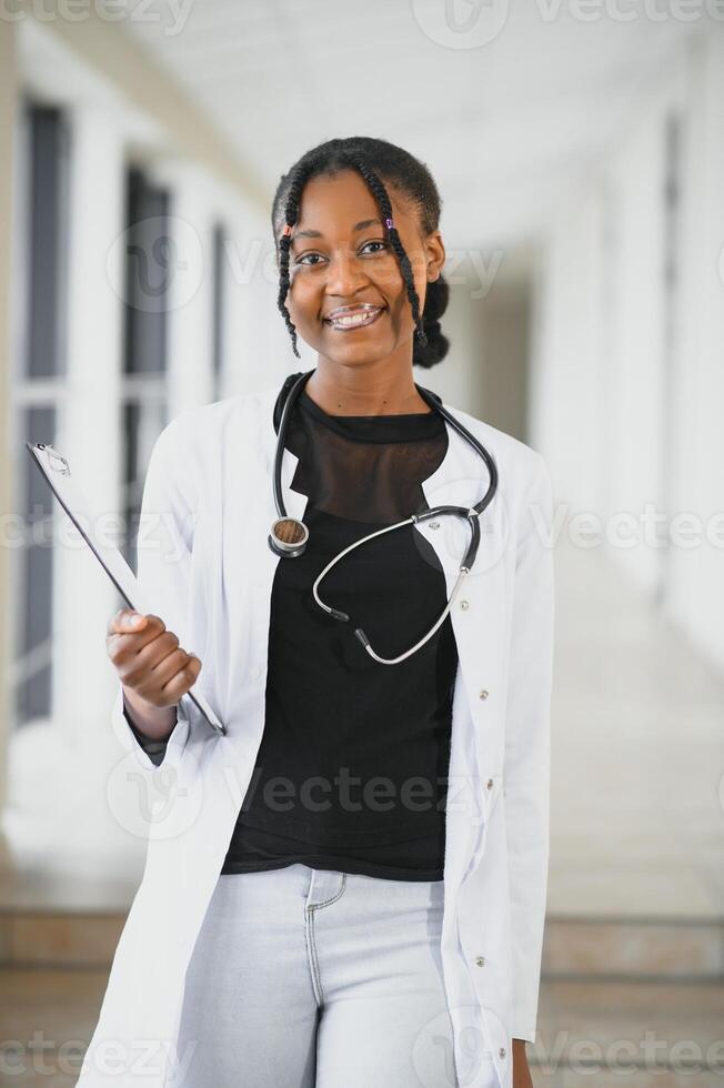beautiful african american female pediatric nurse in modern office photo