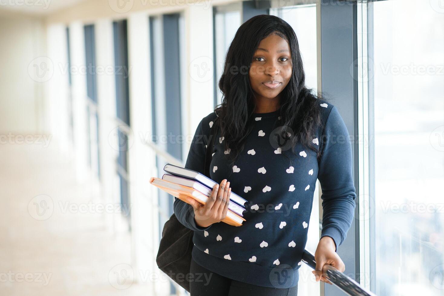 Young african american student girl smiling happy walking at university campus. photo