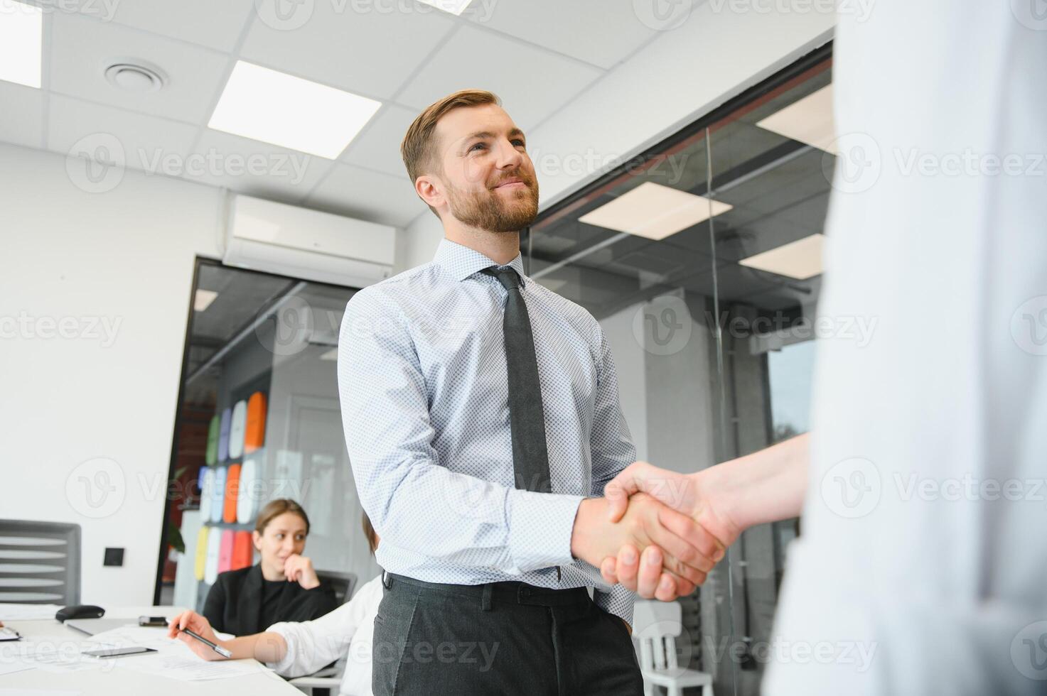 A group of business people partners during a set team meeting in the modern office. Teamwork concept photo