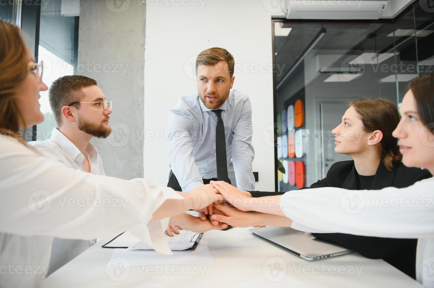 Corporate business team and manager in a meeting room at modern office with panoramic windows. Business concept photo