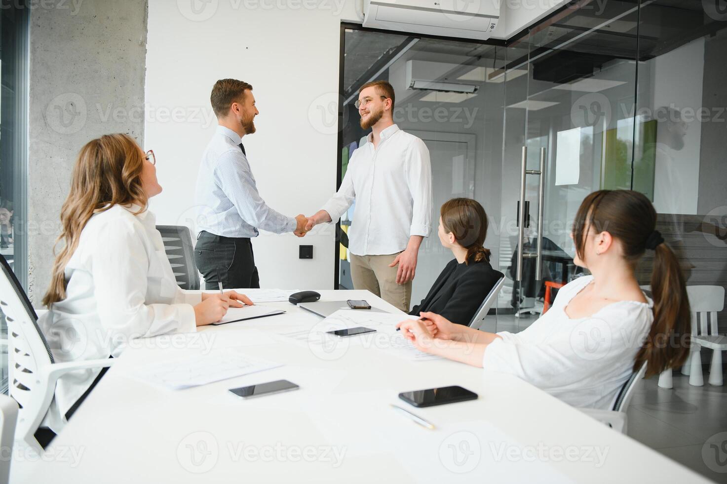 Confident and successful team. Group of people are working together in office. Blurred background photo