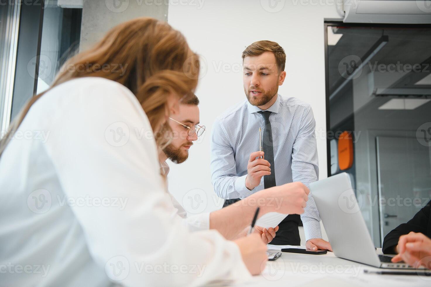 A group of business people partners during a set team meeting in the modern office. Teamwork concept photo