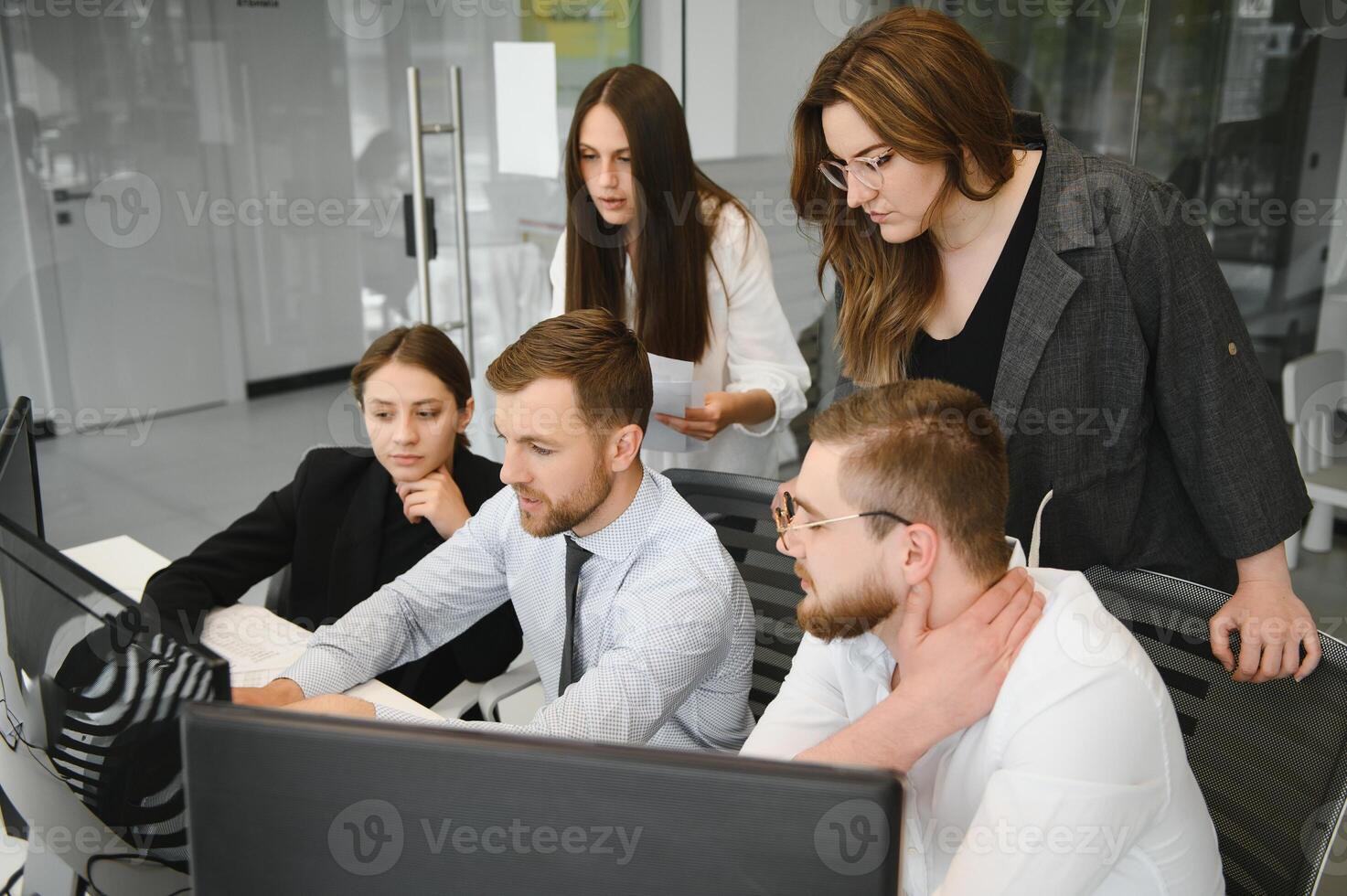 Group of businessmen and businesswomen stock brokers working at office. photo