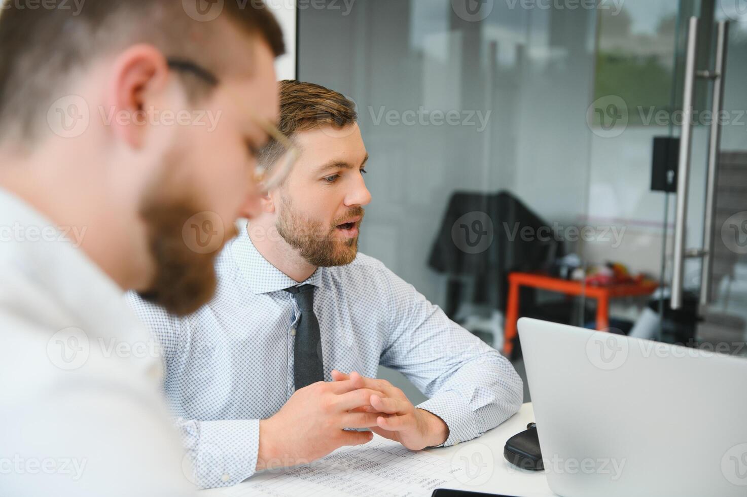 Corporate business team and manager in a meeting room at modern office with panoramic windows. Business concept photo