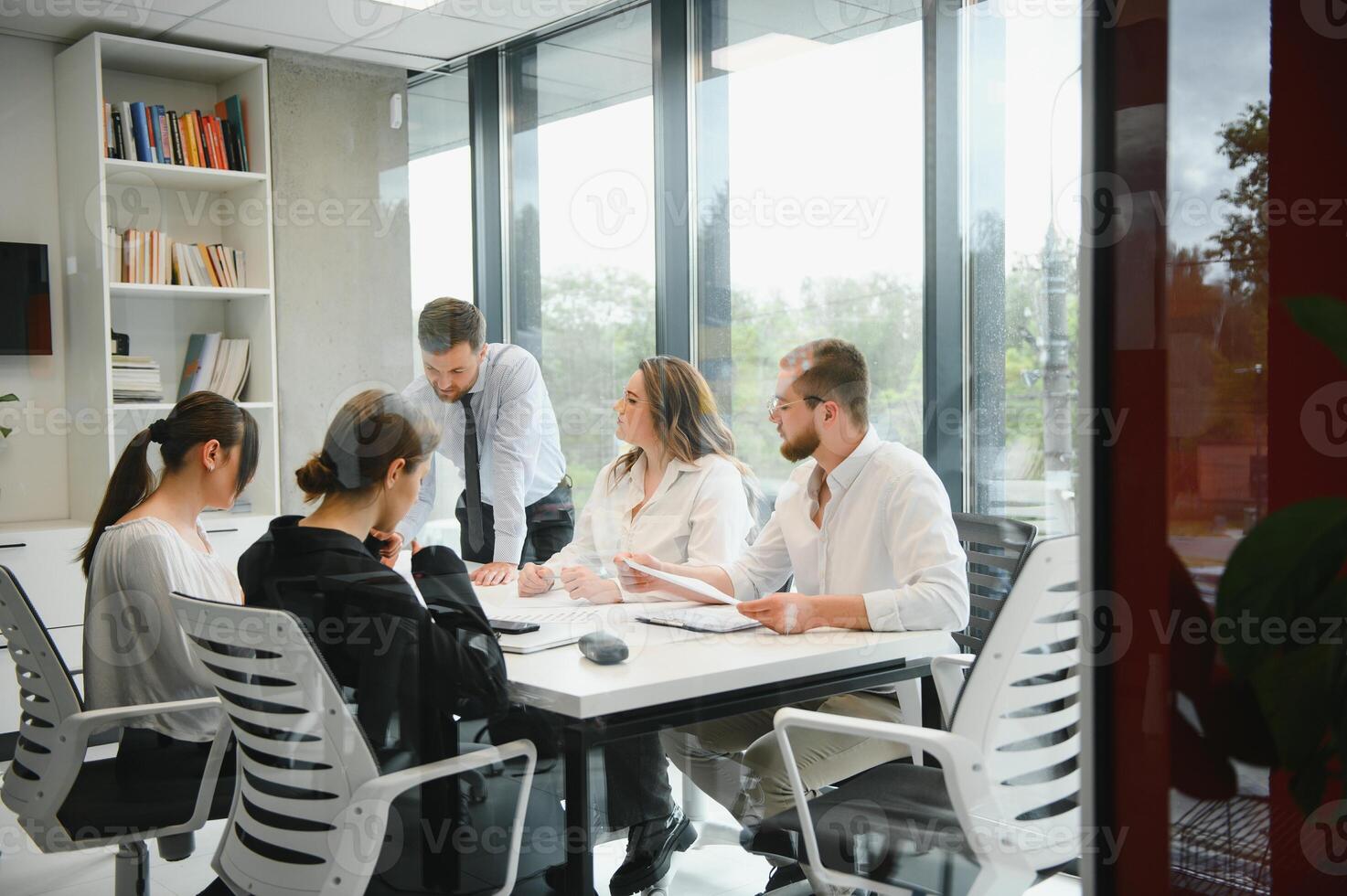 A group of business people partners during a set team meeting in the modern office. Teamwork concept photo