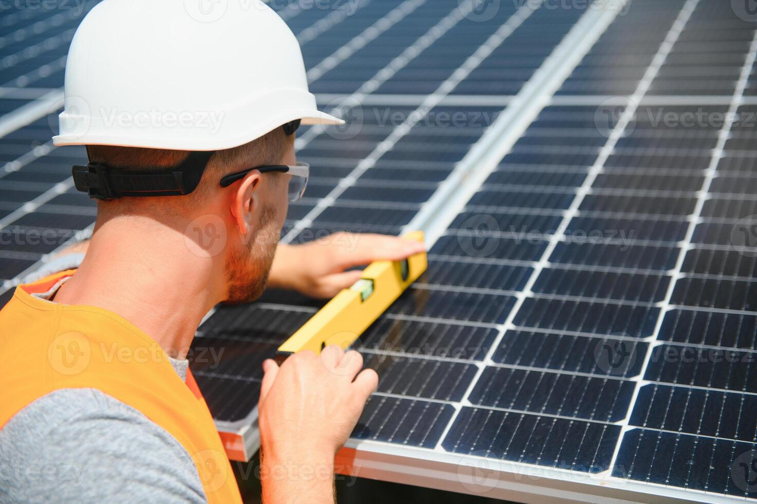A man working at solar power station. photo
