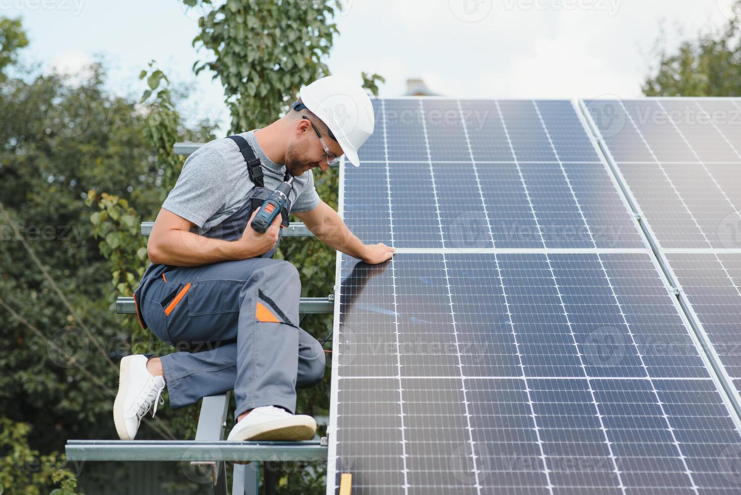 A man working at solar power station. photo
