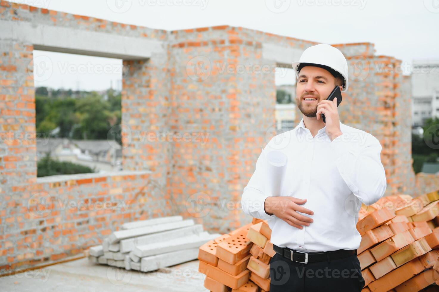 Construction concept of Engineer working at Construction Site with blue print. photo