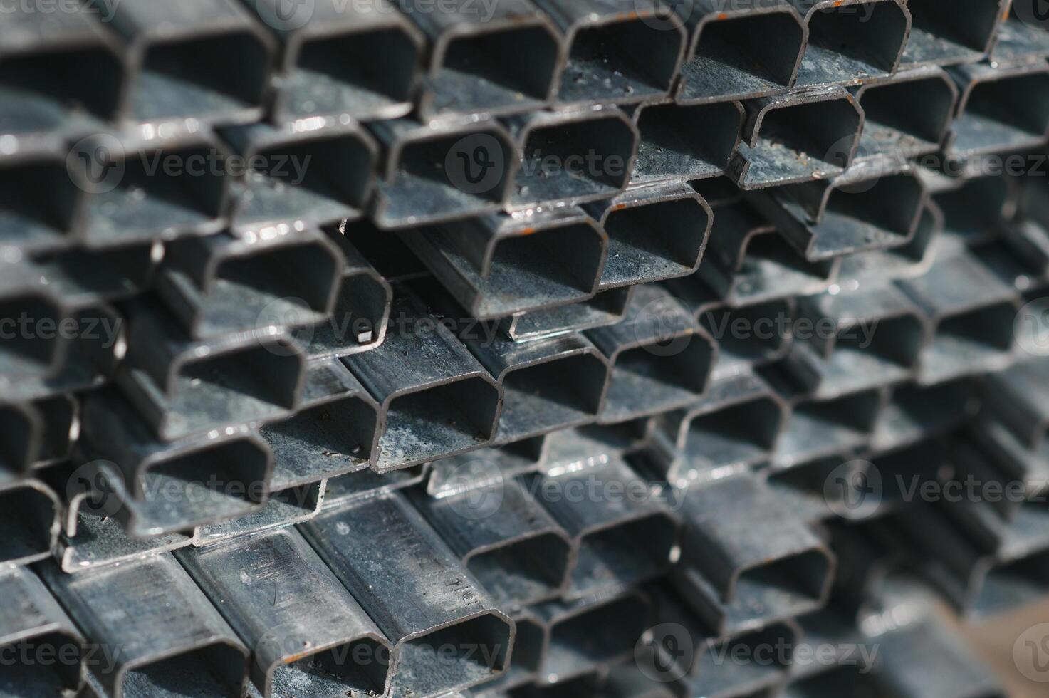 Stack of rolled metal products, perspective view of steel pipes of rectangular cross-section photo