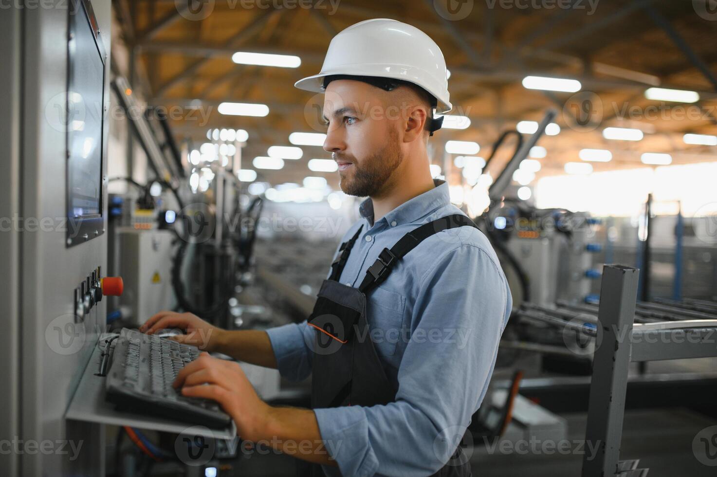 Factory worker. Man working on the production line. photo