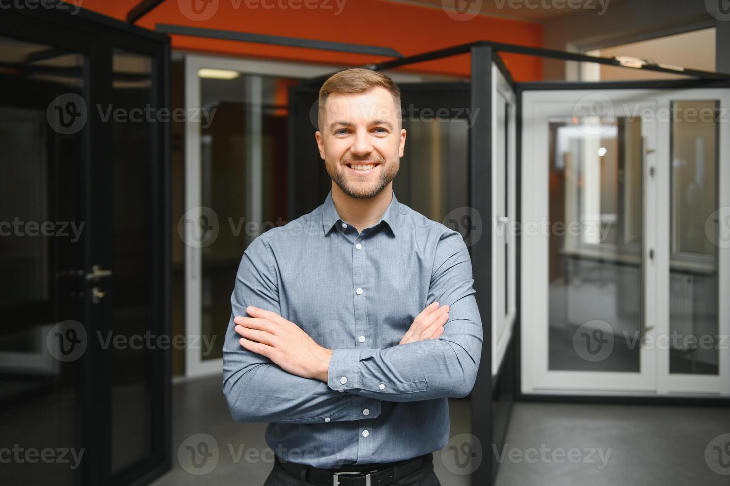 Friendly seller in window shop with keys. A large selection of windows and doors for the house. Home renovation concep photo