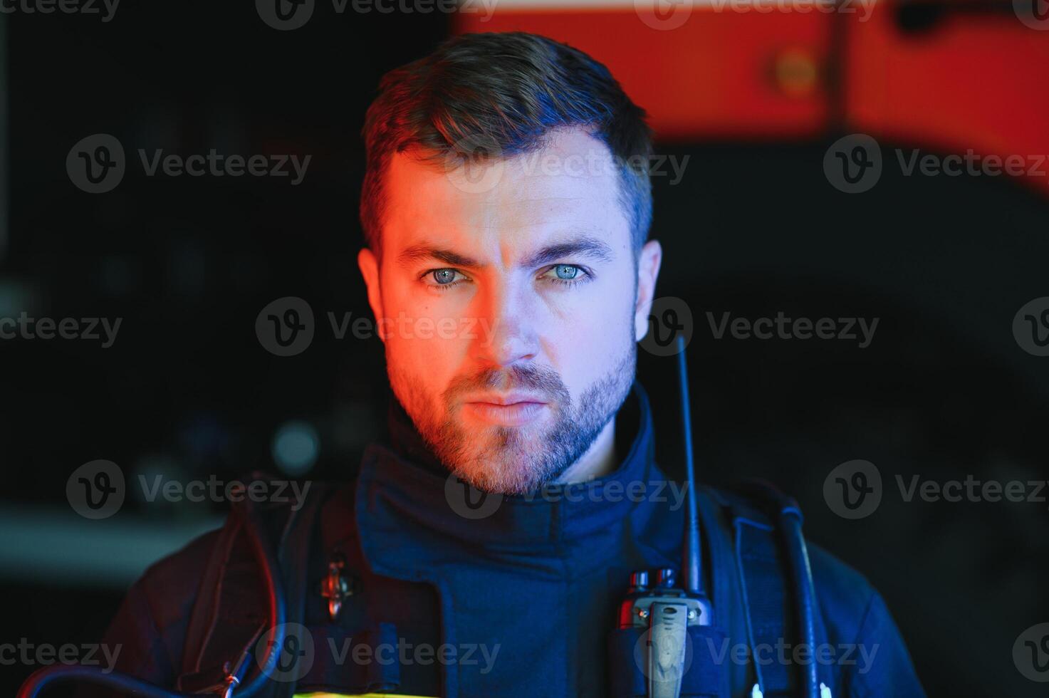 Portrait of police officers with serious faces looking at camera. FBI agent work at the scene at night. photo
