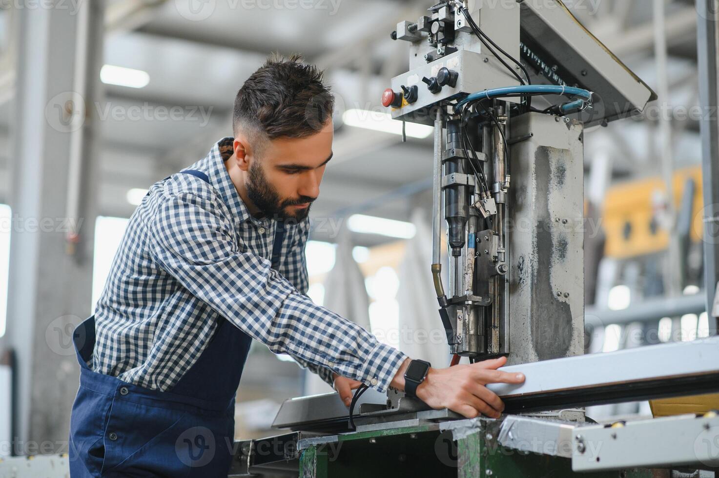 Factory worker. Man working on the production line. photo
