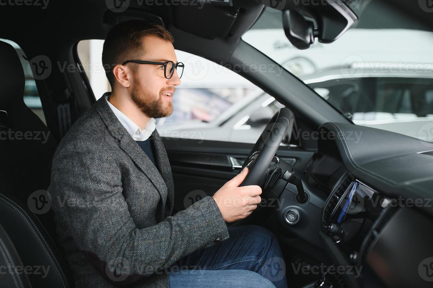 Man adult customer male buyer client wears classic suit white shirt chooses auto wants to buy new automobile photo