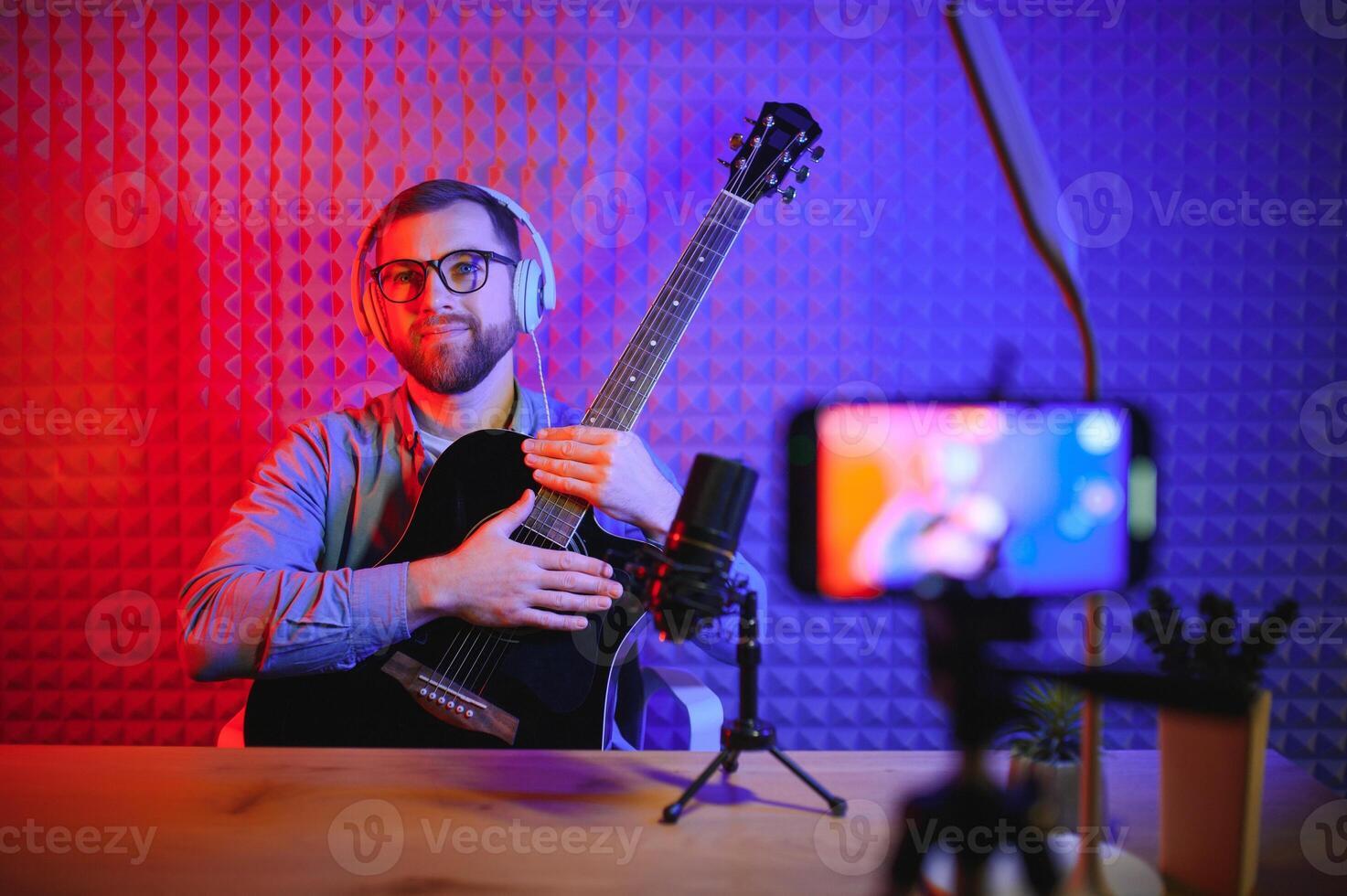 Man singing in a recording studio photo