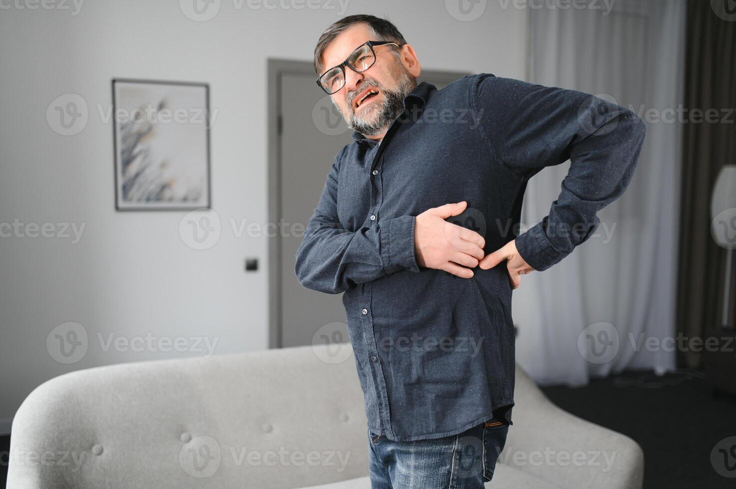 Elderly people with lower back pain photo