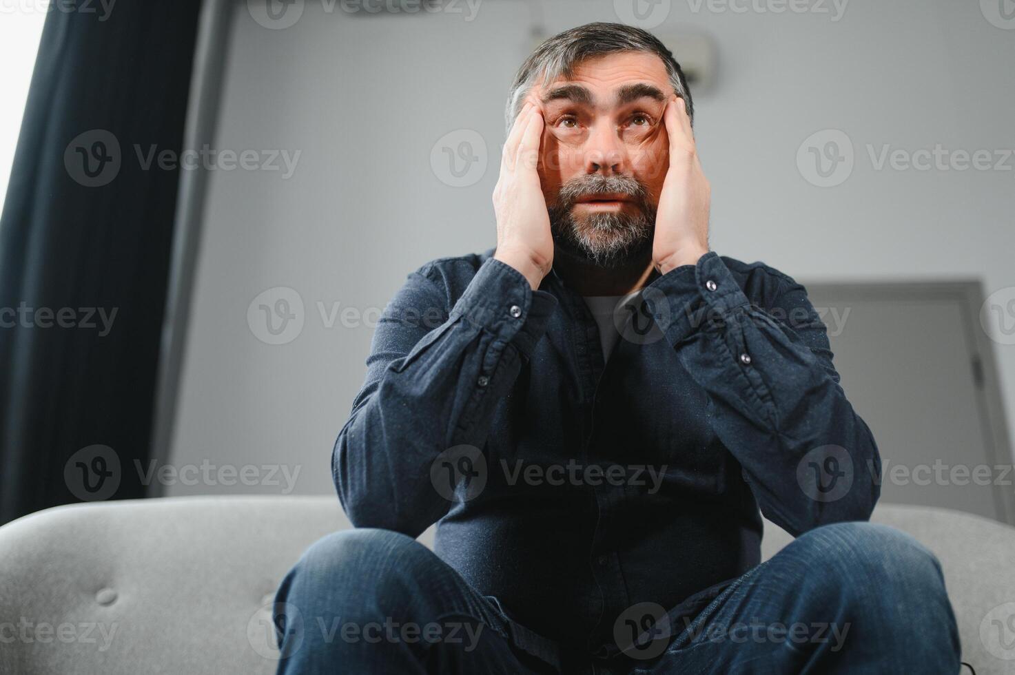 Headache. Senior Man Suffering From Migraine Pain Massaging Temples Sitting At Home. Healthcare, Health Problems In Older Age Concept photo