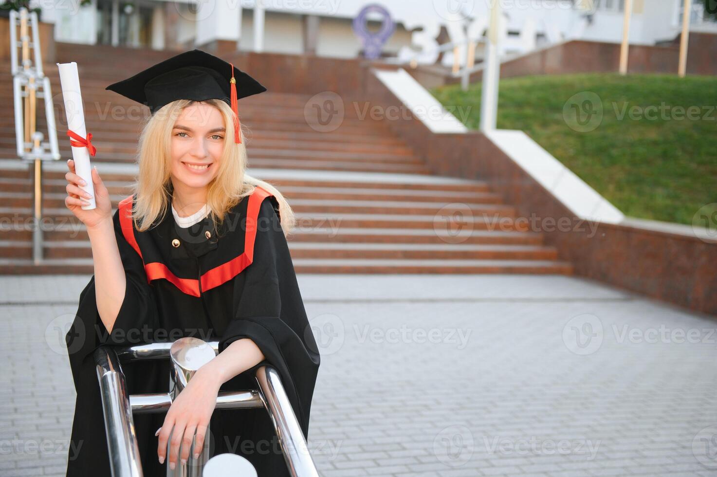 Portrait of a happy woman on her graduation day at university. Education and people. photo