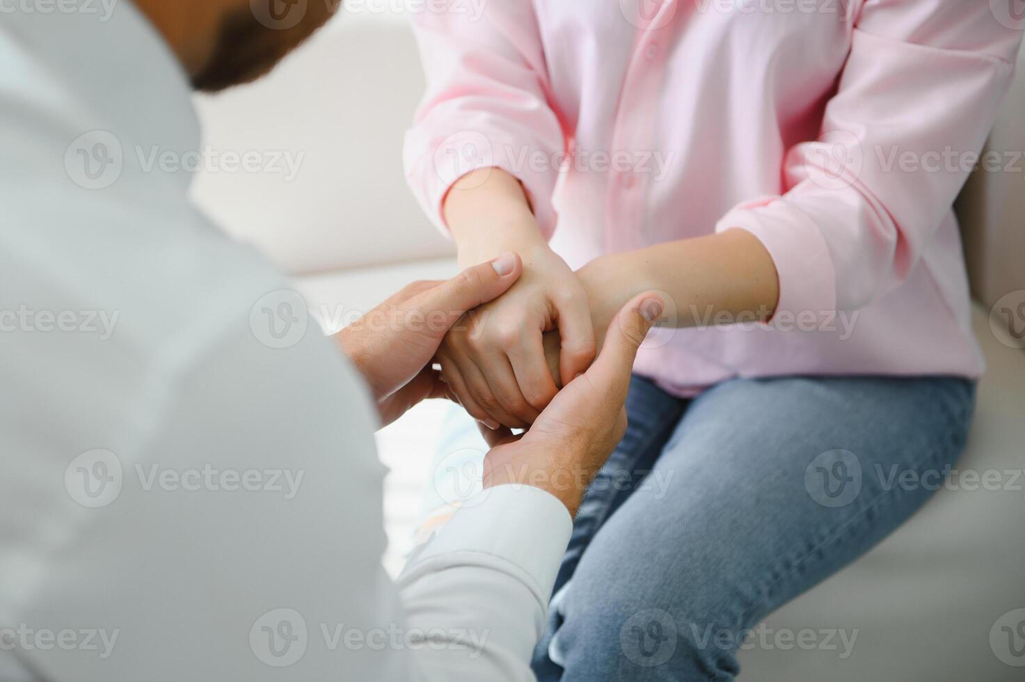 close-up of a female doctor's hands hugging the patient's hands. A gesture of support. Psychological assistance to a woman photo