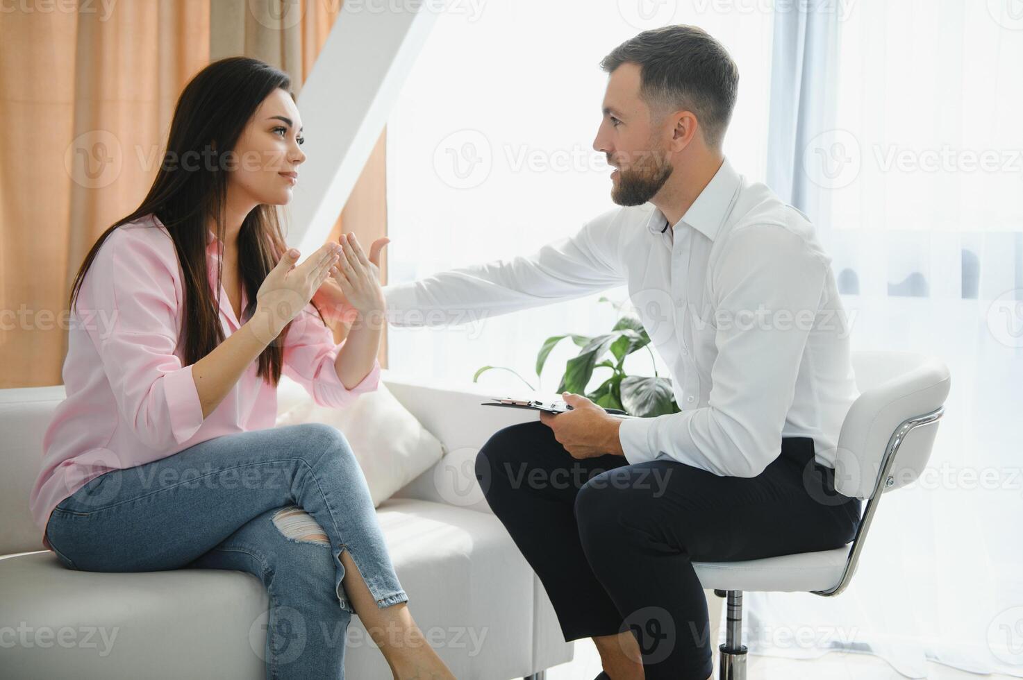 Young woman visiting therapist counselor. Girl feeling depressed, unhappy and hopeless, needs assistance. Serious disease, unwilling pregnancy, abort or death of loved one, addiction to drugs concept photo