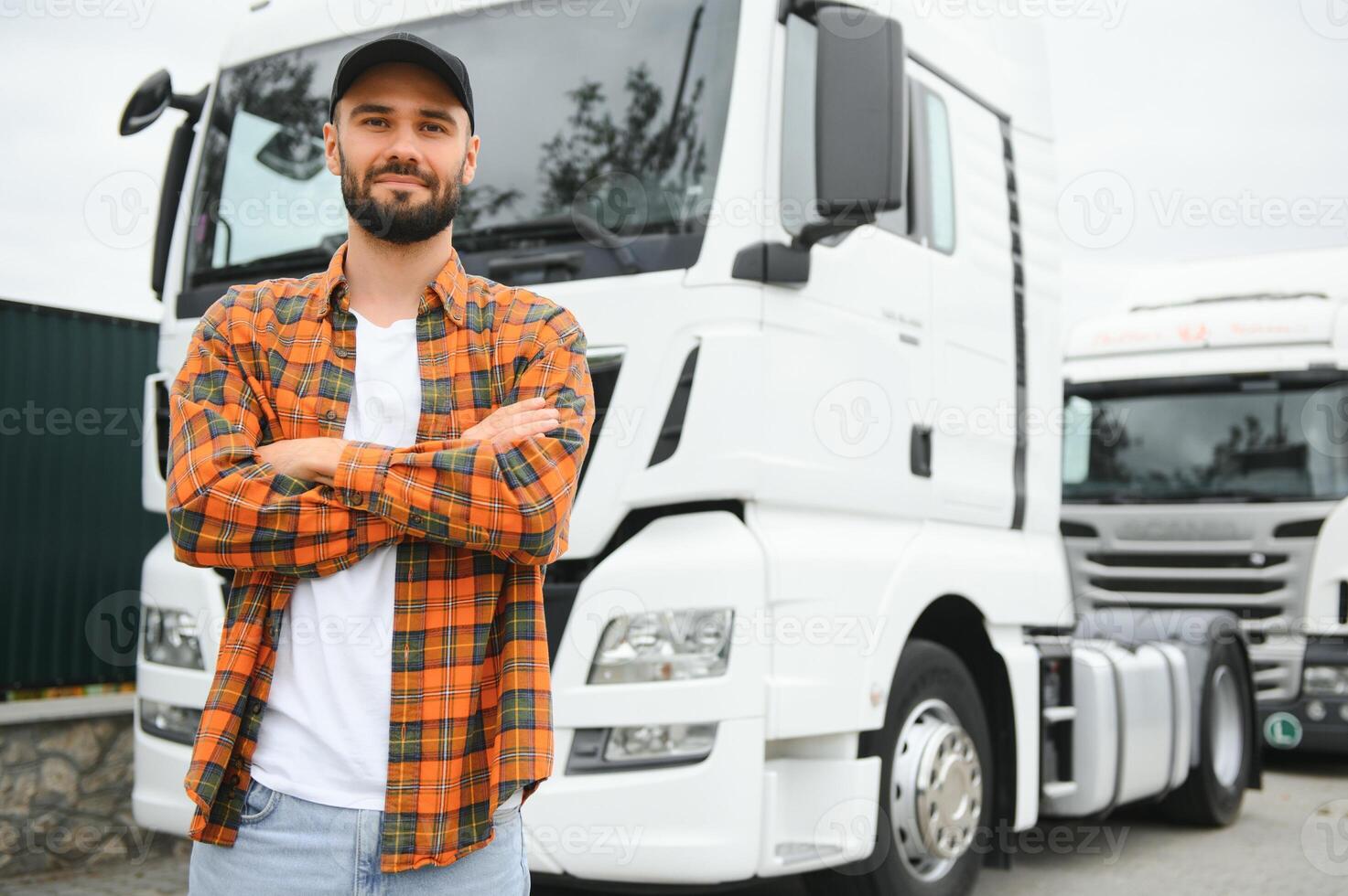 Portrait of confident truck driver on parking lot. Copy space photo