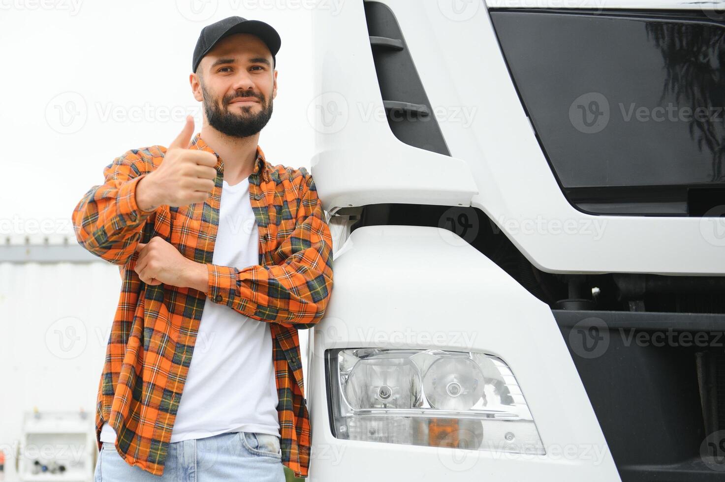 Portrait of confident truck driver on parking lot. Copy space photo