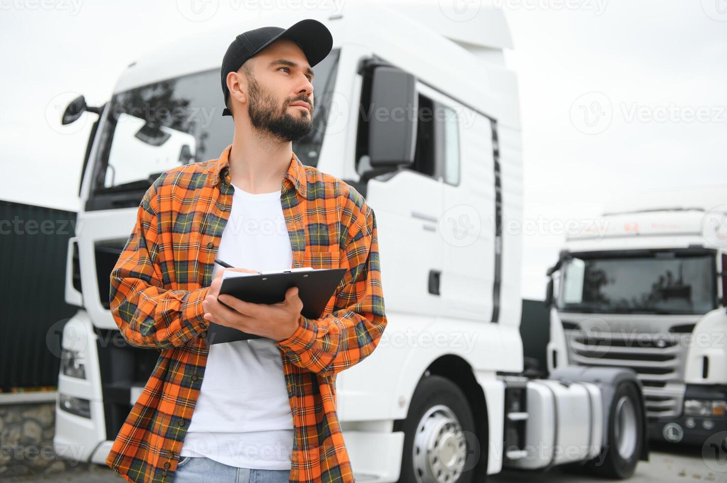Men driver near lorry truck. Man owner truck driver near truck. Man trucker trucking owner. Transportation industry vehicles. Handsome man driver front of truck. photo