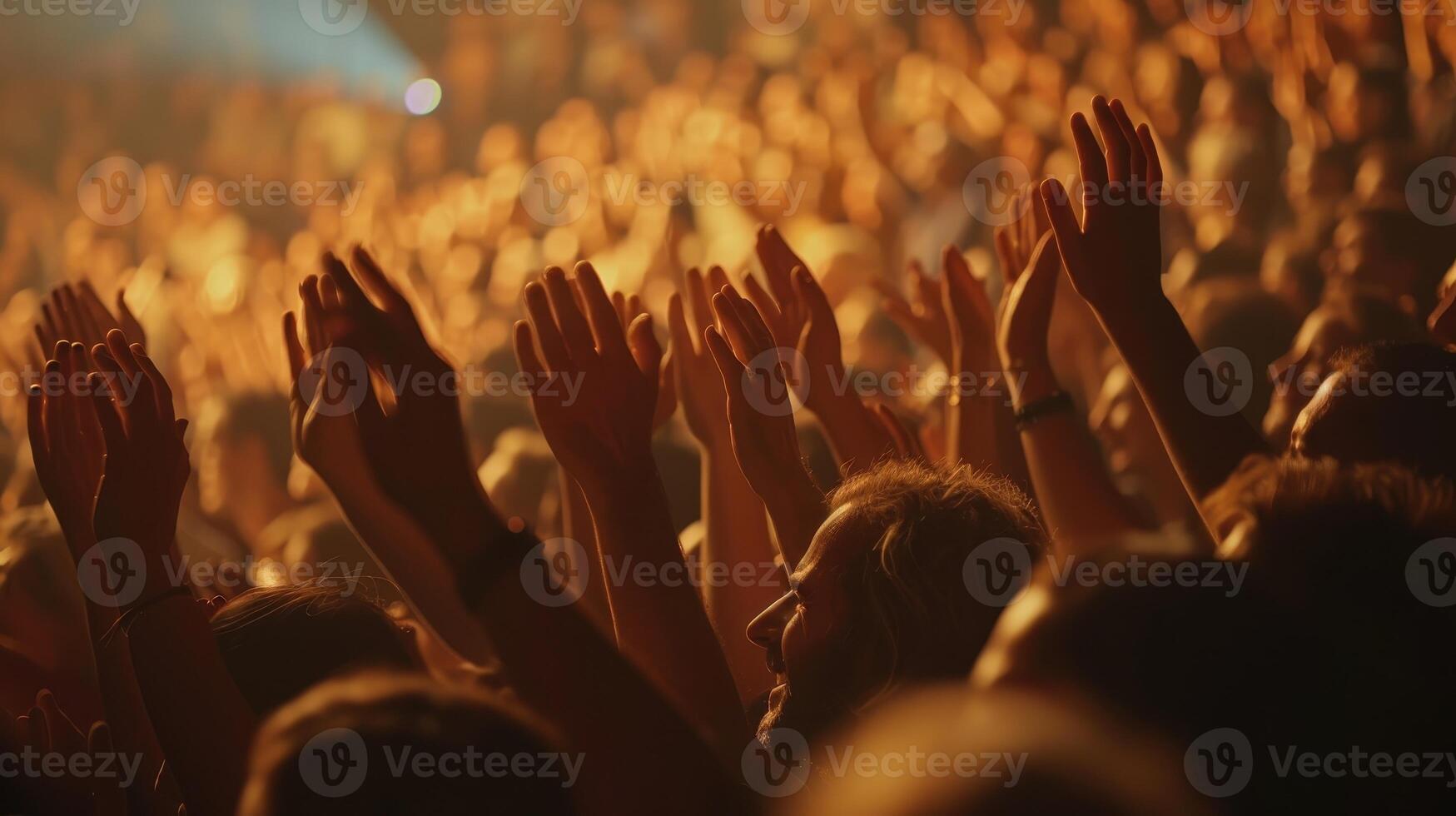 Vibrant Audience Cheers Enthusiastically at Live Concert Amidst Colorful Stage Lights in a Packed Venue photo